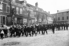 Band marching down Market Hill